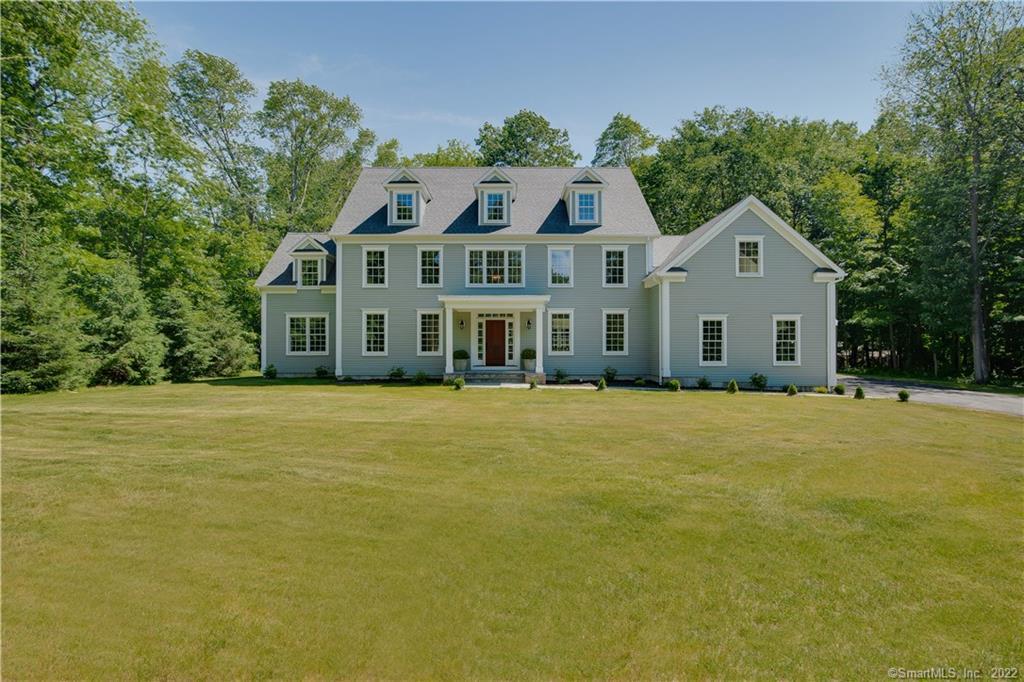 159 Cannon Road Wilton, CT 06897 - Photo 1 of 1 a front view of a house with a garden