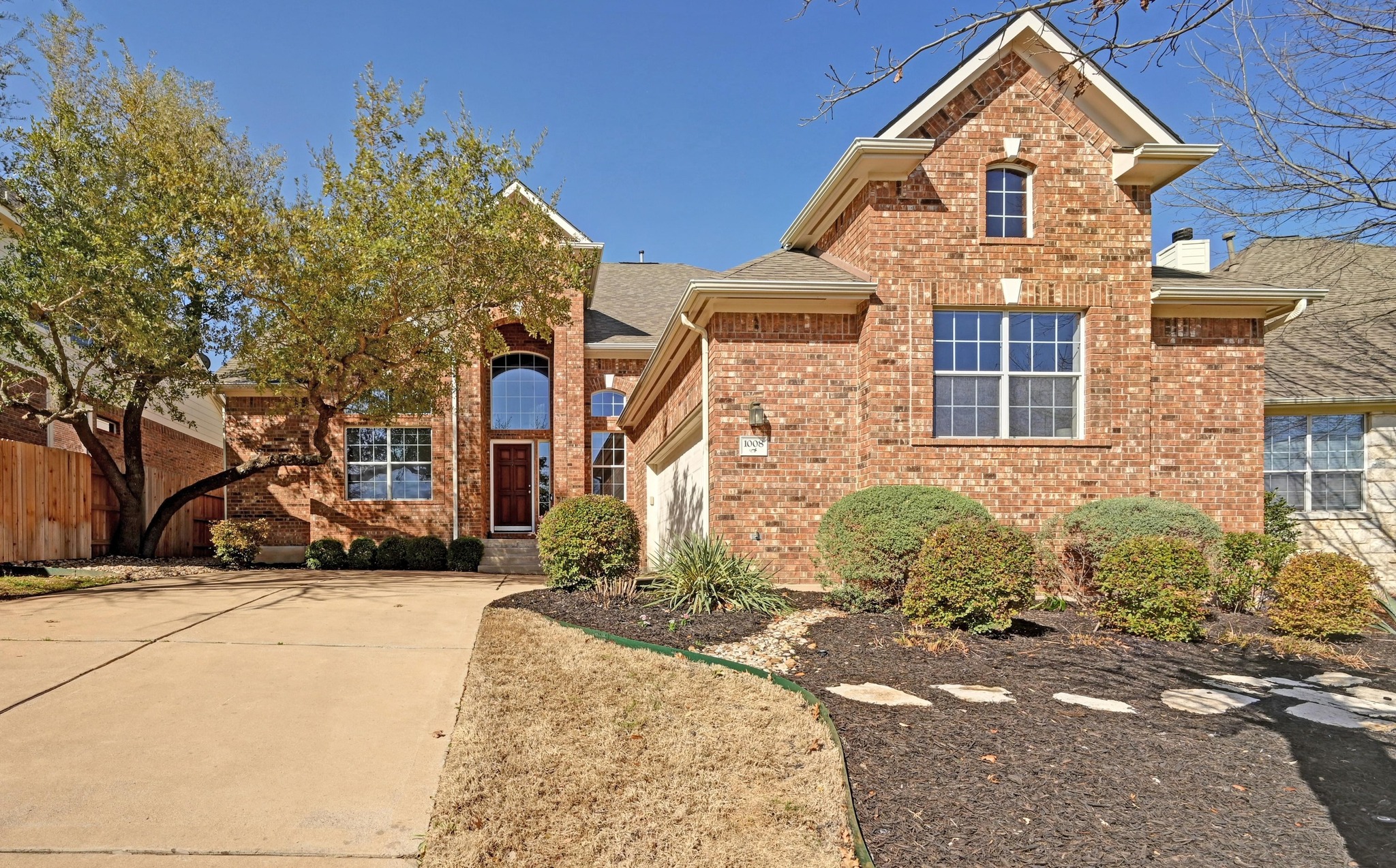 1008 Cavalry Ride Trail Austin, TX 78732 - Photo 1 of 1 a front view of a house with a yard