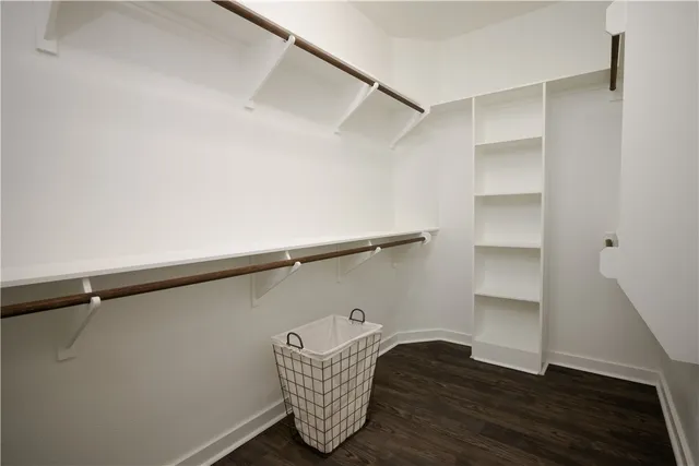 a view of storage and utility room with wooden floor