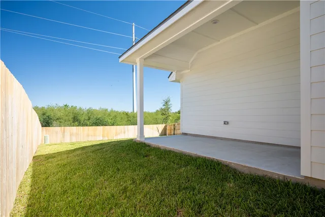 a view of a backyard with lake view