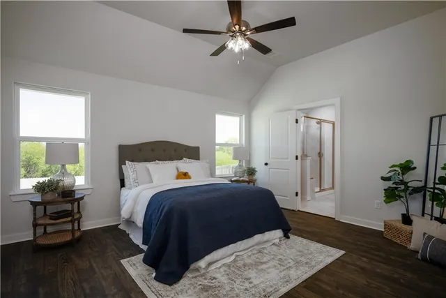 a bedroom with a bed furniture and a window