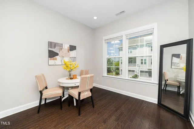a kitchen with granite countertop a sink a stove and cabinets