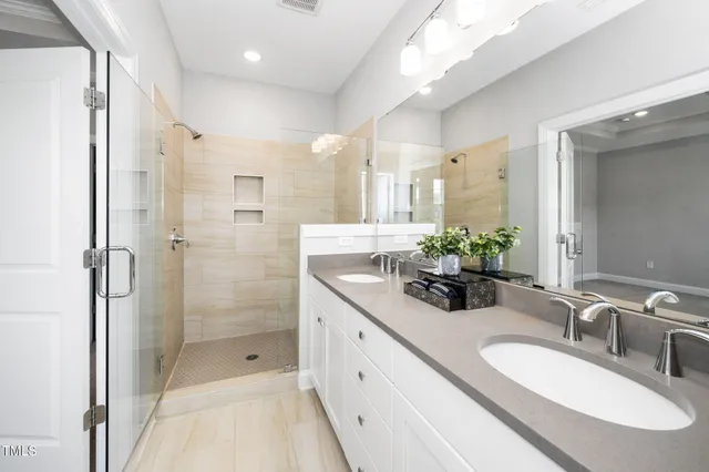 a view of a patio with table and chairs and potted plants
