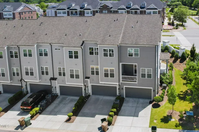 an aerial view of a house with garden space and sitting space