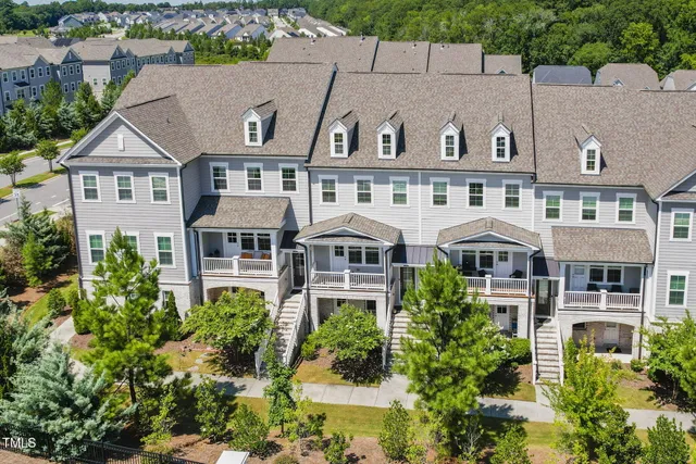 an aerial view of a house with sitting area and furniture