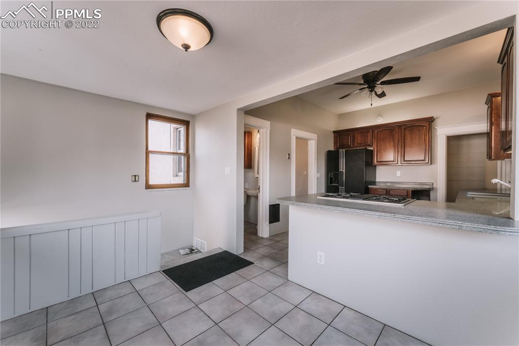 1018 East Boulder Street Colorado Springs, CO 80903 - Photo 13 of 40 a kitchen with stainless steel appliances granite countertop a refrigerator and a sink