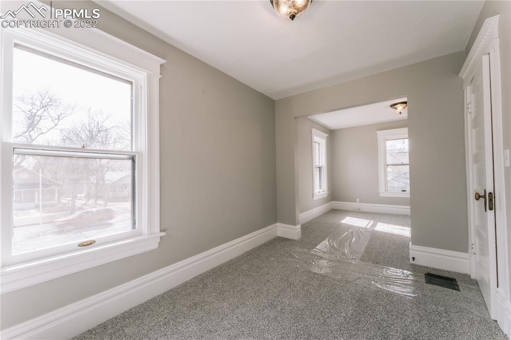 1018 East Boulder Street Colorado Springs, CO 80903 - Photo 18 of 40 an empty room that has a window