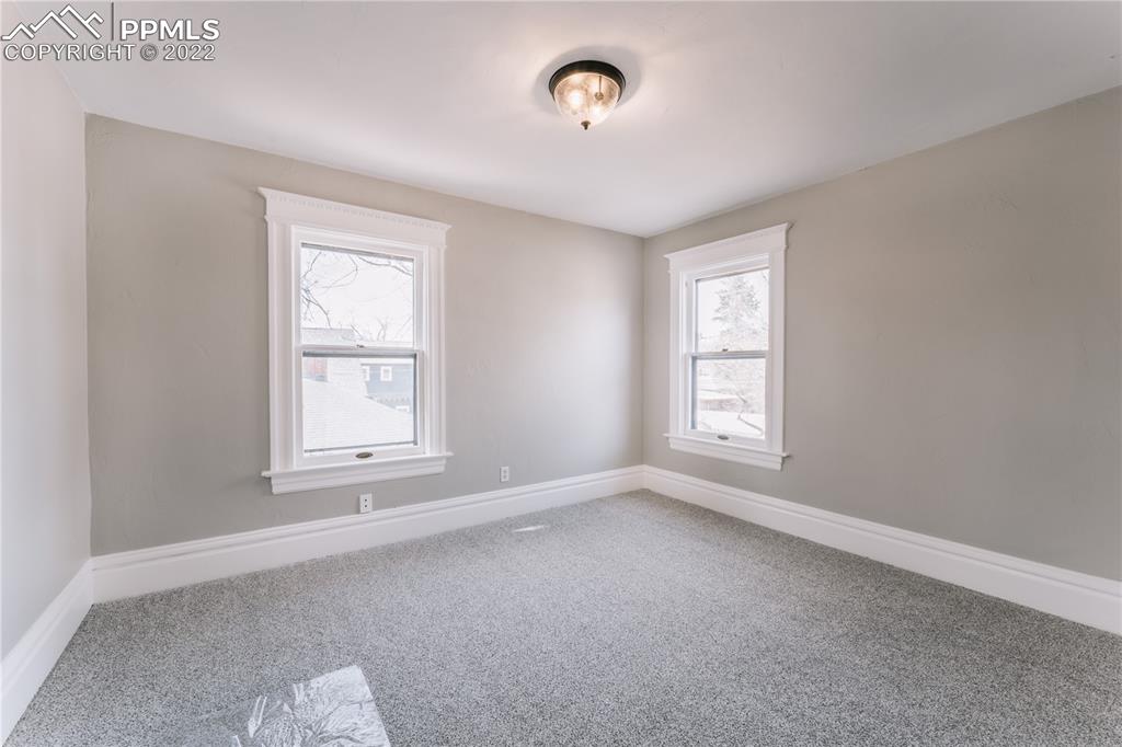 1018 East Boulder Street Colorado Springs, CO 80903 - Photo 20 of 40 an empty room with windows