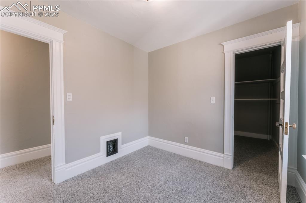 1018 East Boulder Street Colorado Springs, CO 80903 - Photo 21 of 40 a view of an empty room with closet and a window