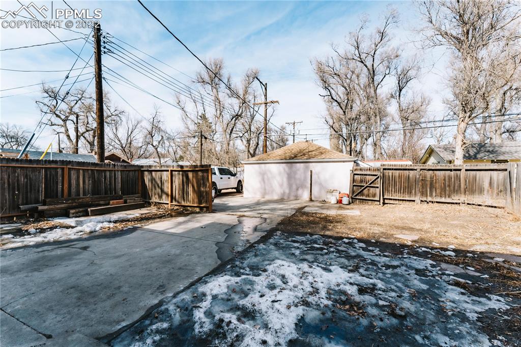 1018 East Boulder Street Colorado Springs, CO 80903 - Photo 34 of 40 a view of a yard with snow on the road