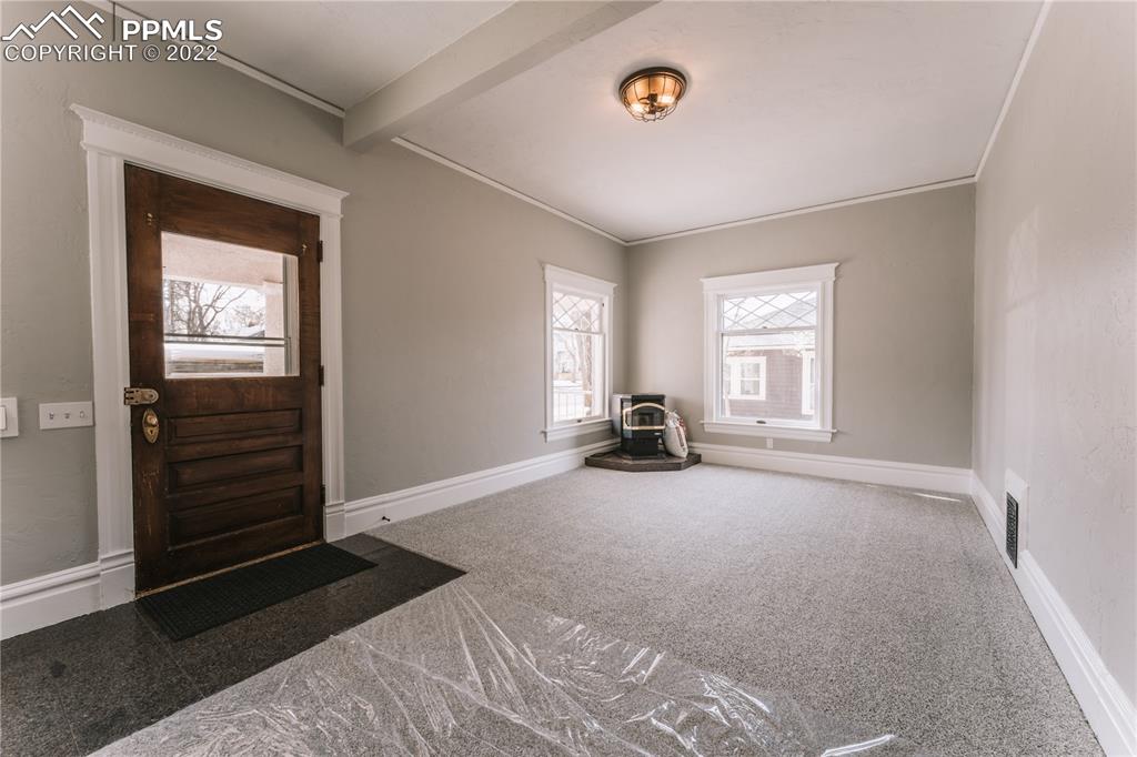 1018 East Boulder Street Colorado Springs, CO 80903 - Photo 5 of 40 a view of a livingroom with a staircase