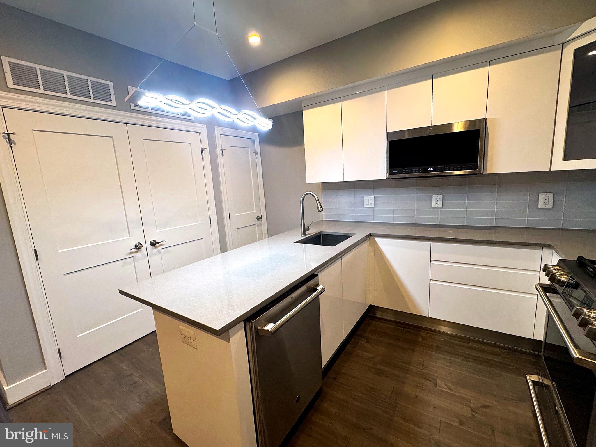 625 Park Road Northwest Washington, DC 20010 - Photo 7 of 22 Sleek modern kitchen with stylish finishes.