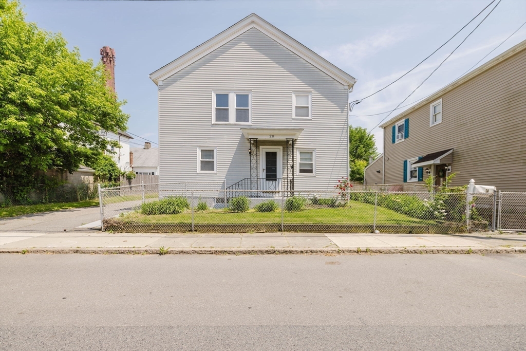 20 Wilcox Street Fall River, MA 02724 - Photo 1 of 28 a front view of house with a garden and plants