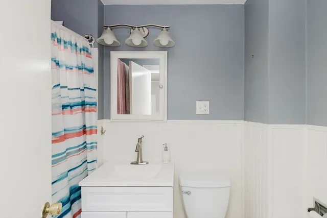 a view of livingroom with hardwood floor and ceiling fan