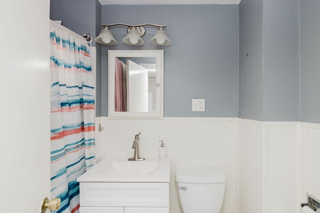20 Wilcox Street Fall River, MA 02724 - Photo 11 of 28 a bathroom with a sink and a mirror