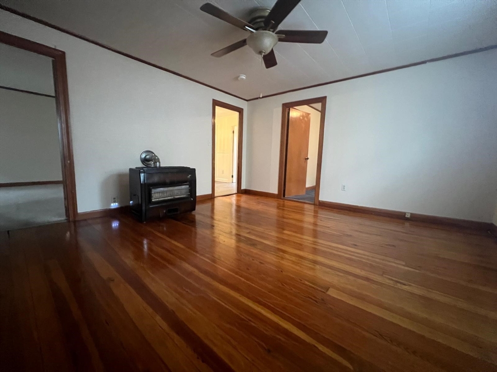 20 Wilcox Street Fall River, MA 02724 - Photo 12 of 28 a view of livingroom with hardwood floor and ceiling fan