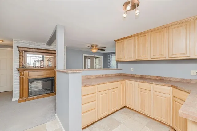 a kitchen with granite countertop a sink and a stove top oven