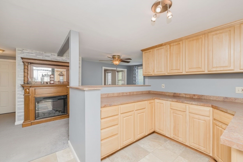 20 Wilcox Street Fall River, MA 02724 - Photo 19 of 28 a kitchen with granite countertop white cabinets and white appliances