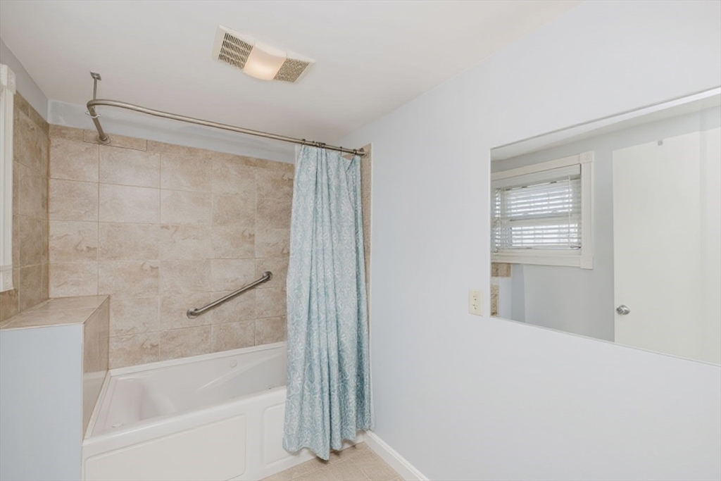 20 Wilcox Street Fall River, MA 02724 - Photo 25 of 28 a bathroom with a bathtub and a shower