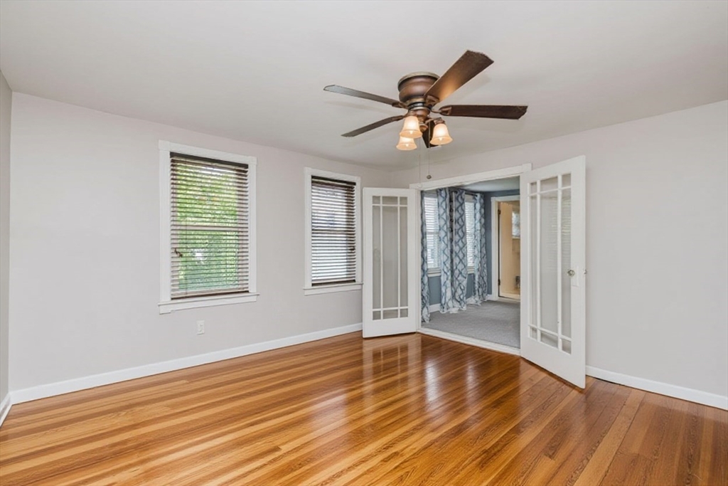 20 Wilcox Street Fall River, MA 02724 - Photo 26 of 28 a view of an empty room with wooden floor and a window