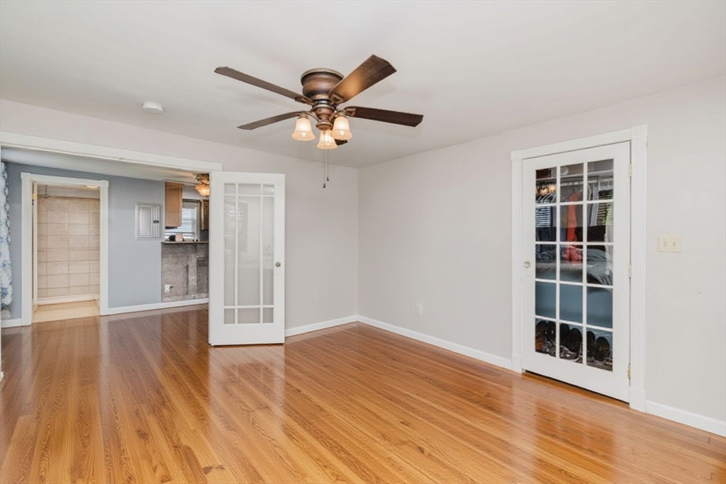 20 Wilcox Street Fall River, MA 02724 - Photo 27 of 28 a view of an empty room with wooden floor and a window