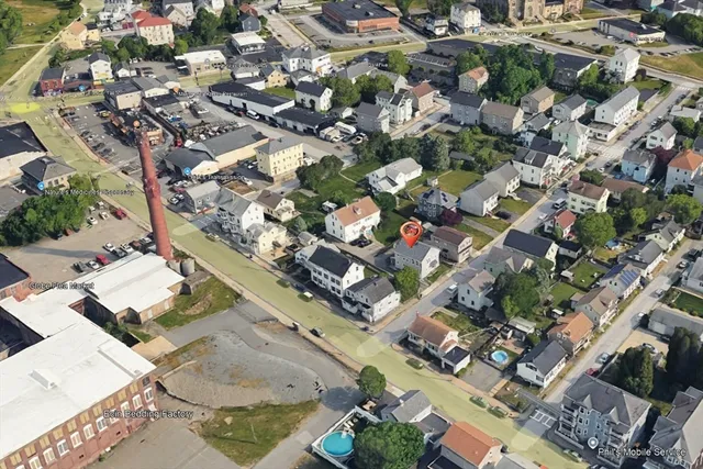 an aerial view of a building with outdoor space