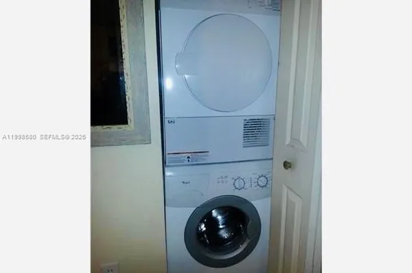 a close view of a utility room with washer and dryer