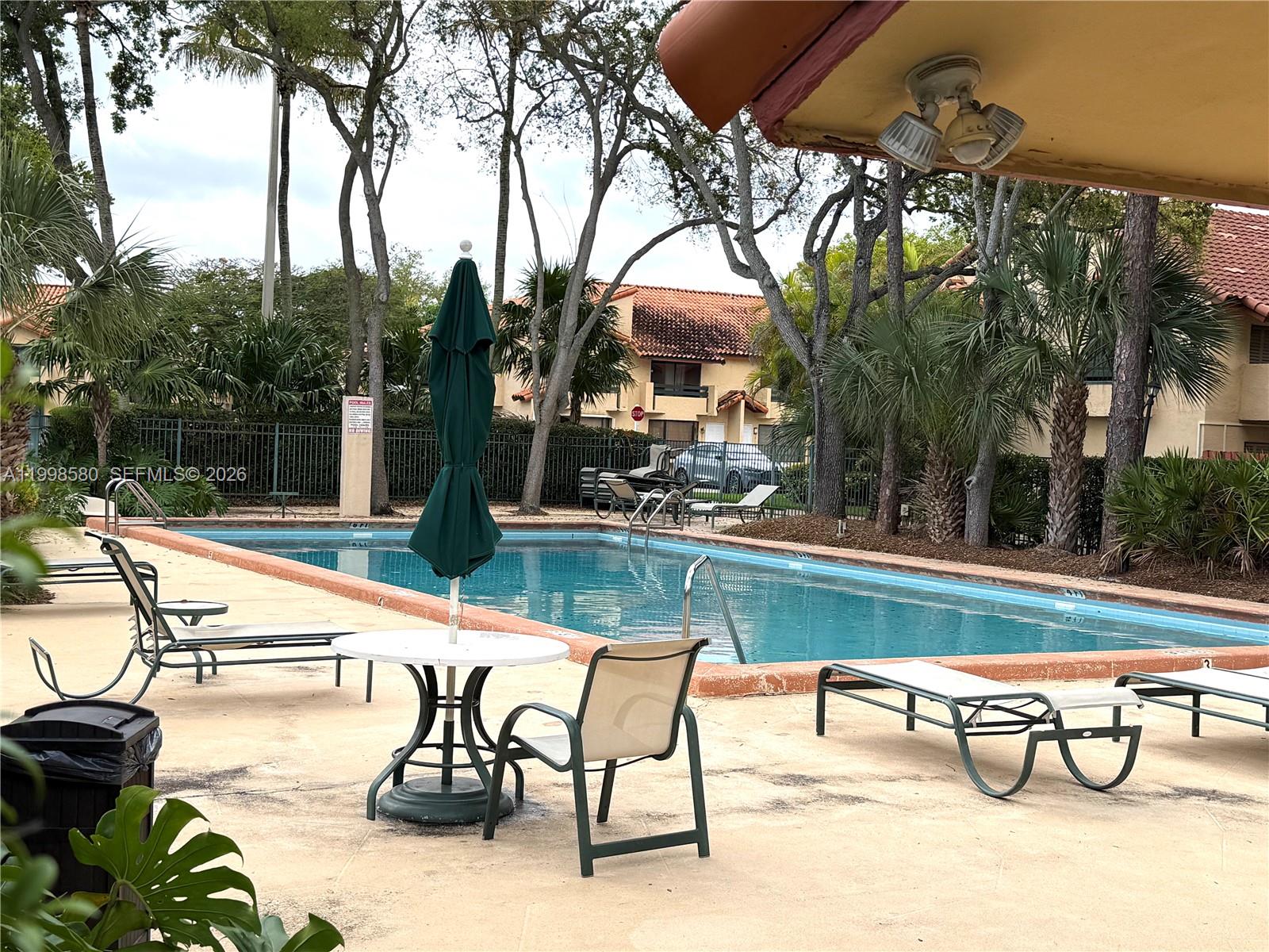 10029 Southwest 77th Court Miami, FL 33156 - Photo 7 of 10 a view of swimming pool with patio
