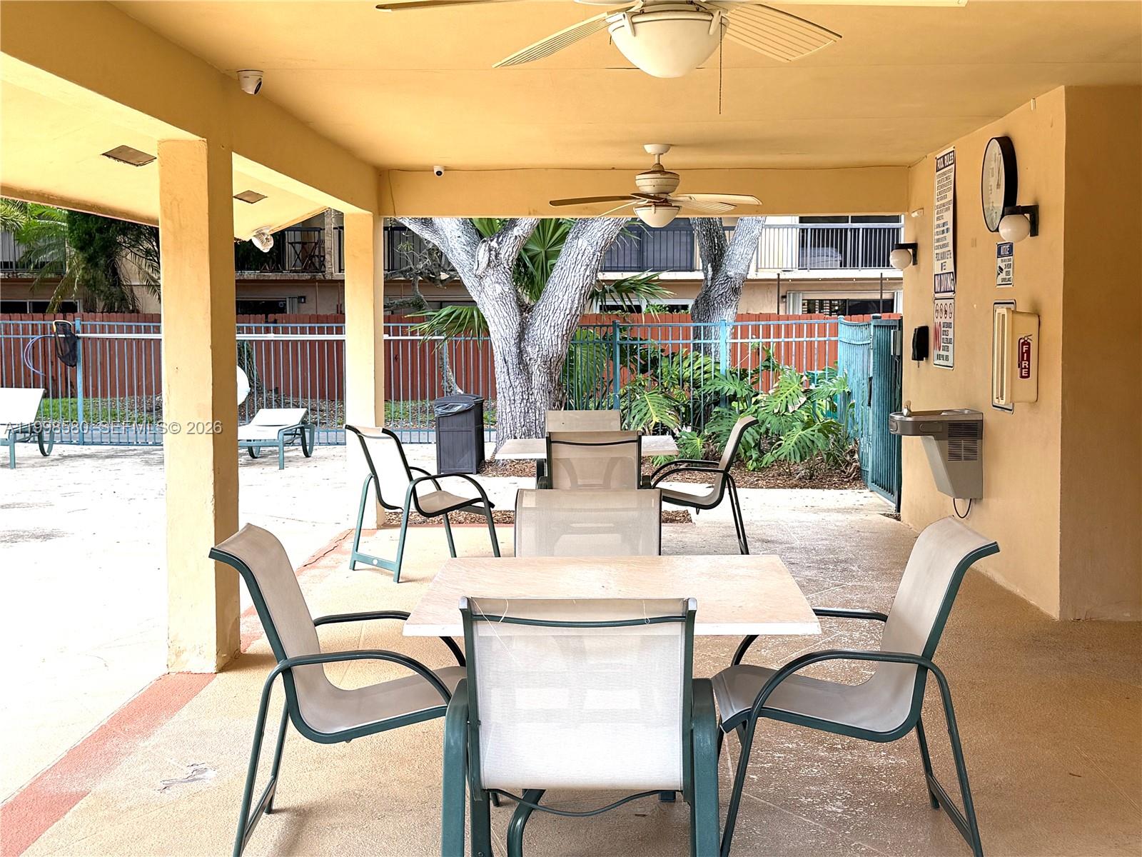 10029 Southwest 77th Court Miami, FL 33156 - Photo 8 of 10 a view of a dining room with furniture and a table