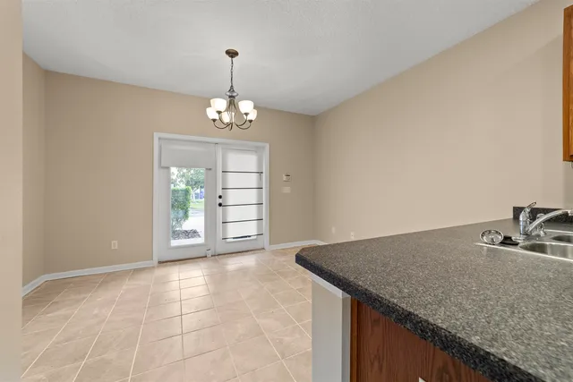 a view of a kitchen with granite countertop a sink