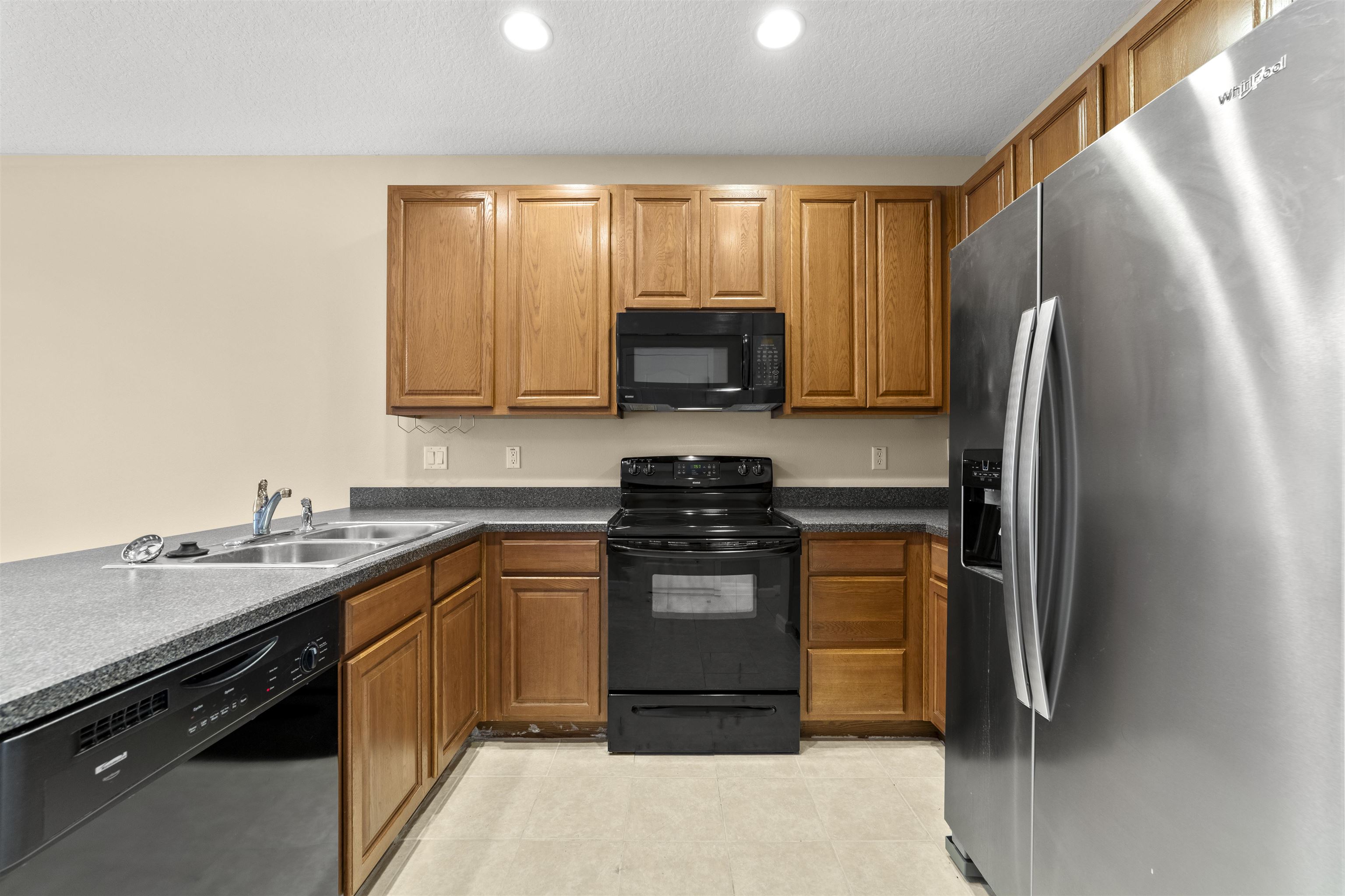 652 Drake Bay Terrace St. Augustine, FL 32084 - Photo 14 of 30 a kitchen with a sink stove and refrigerator