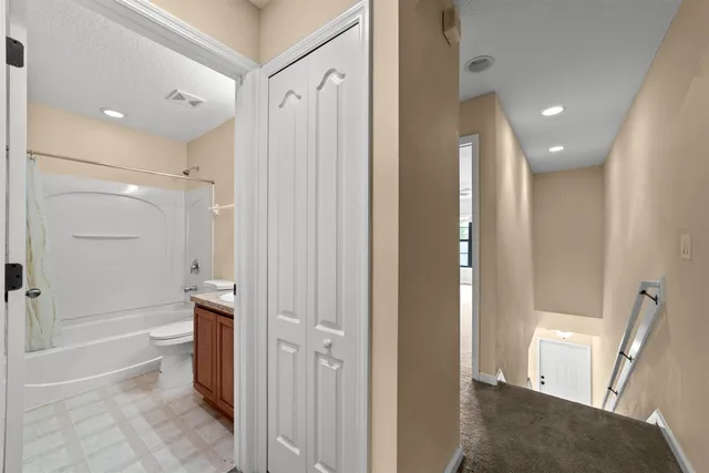 a bathroom with a shower and a tub
