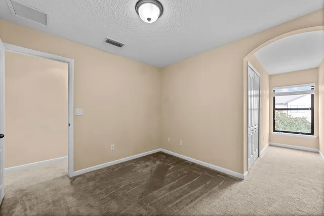 a view of a hallway with windows