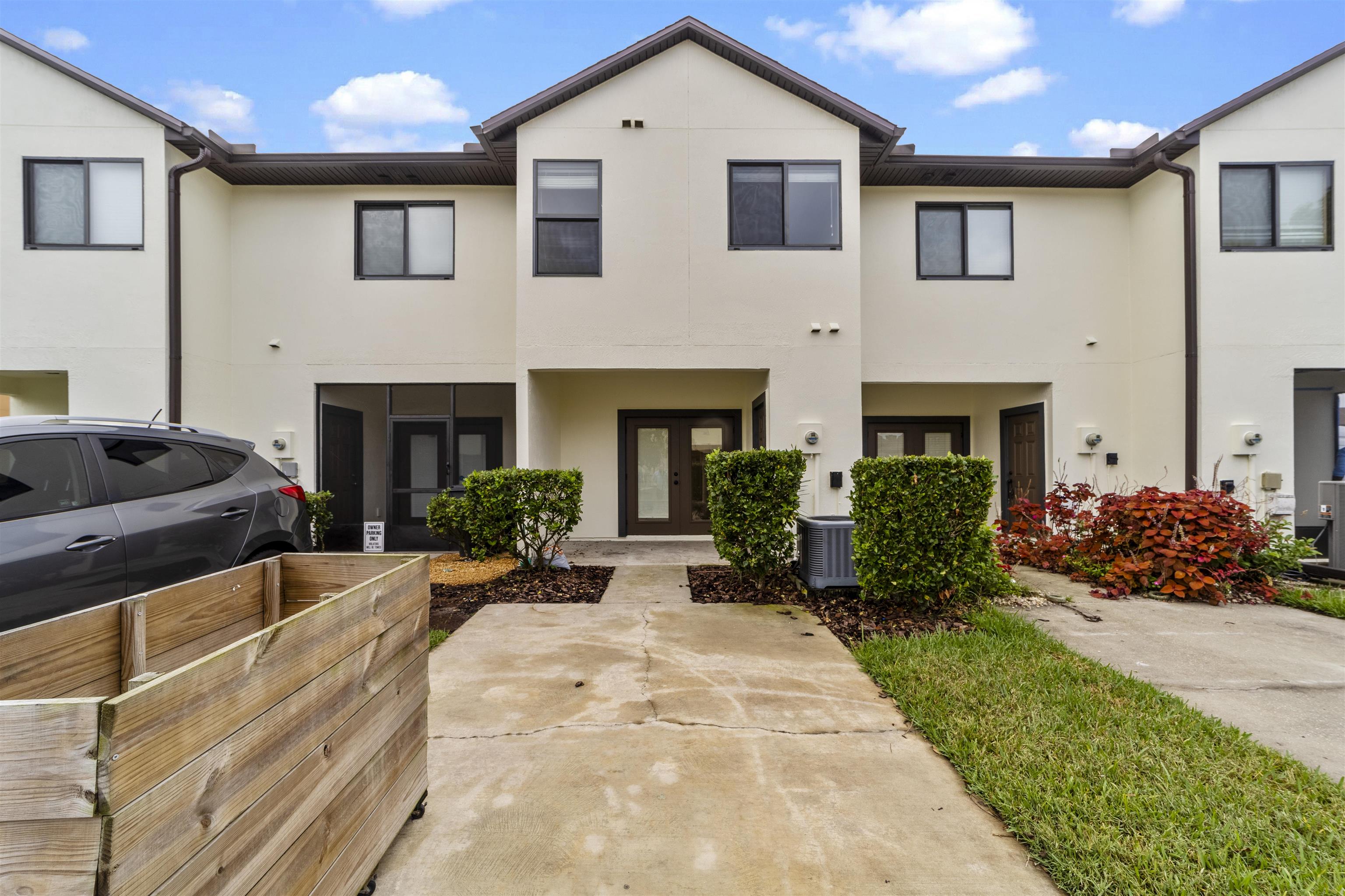 652 Drake Bay Terrace St. Augustine, FL 32084 - Photo 3 of 30 a front view of a house with a yard and potted plants