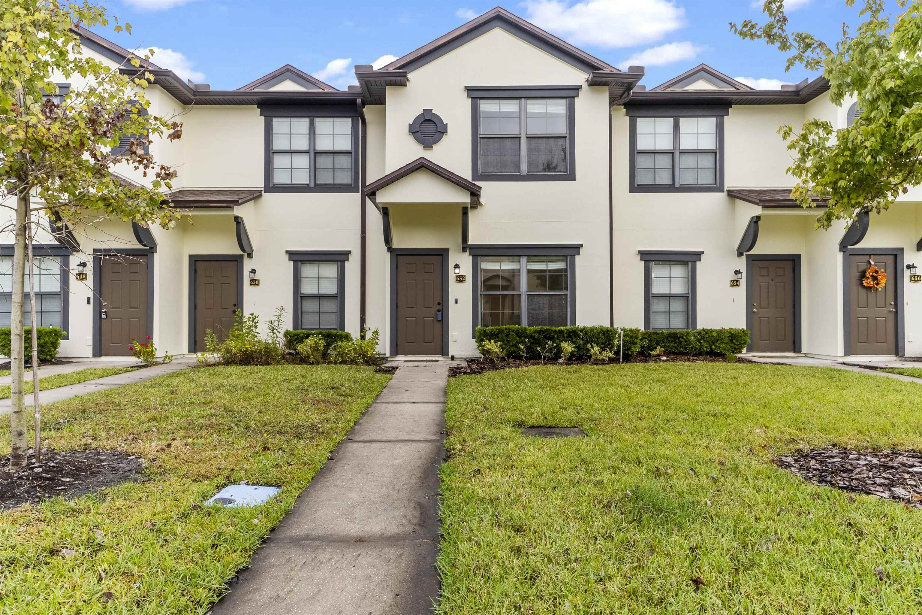 652 Drake Bay Terrace St. Augustine, FL 32084 - Photo 4 of 30 a front view of a house with a yard