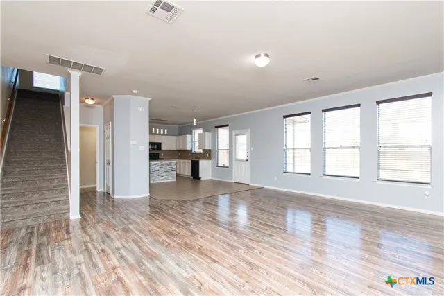 a view of a livingroom with wooden floor