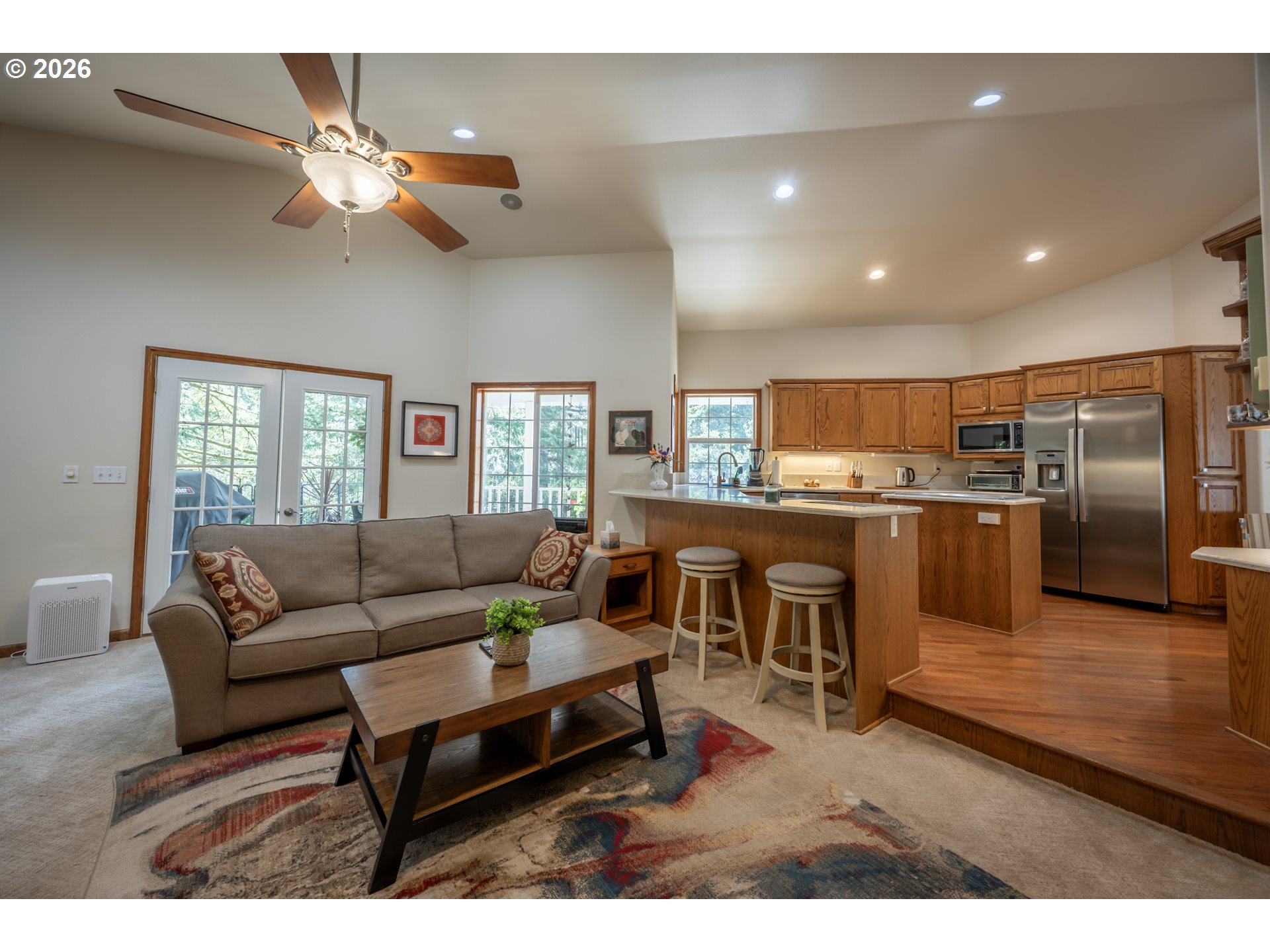 2193 13th Street Florence, OR 97439 - Photo 30 of 48 a living room with furniture kitchen view and a wooden floor