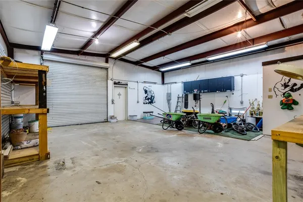 a view of a garage with white walls