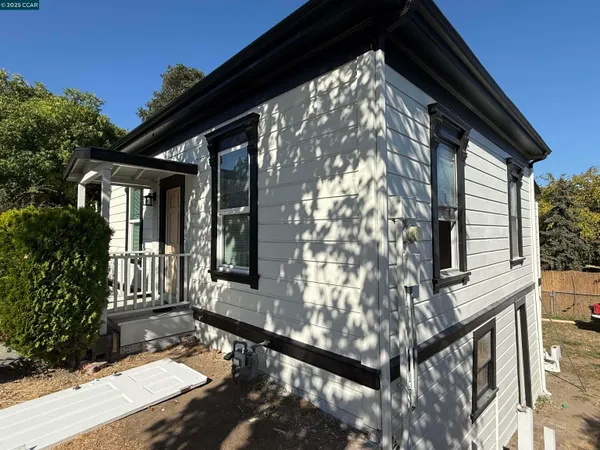 a view of house with backyard