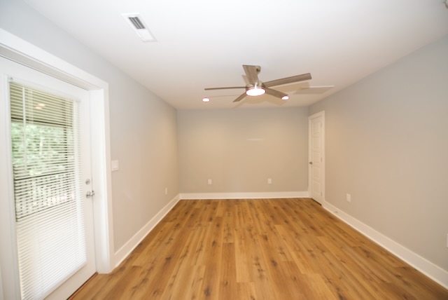 317 Pendleton Road Clemson, SC 29631 - Photo 29 of 36 Hardwood-style flooring and a ceiling fan create a comfortable and inviting atmosphere in this versatile interior space.