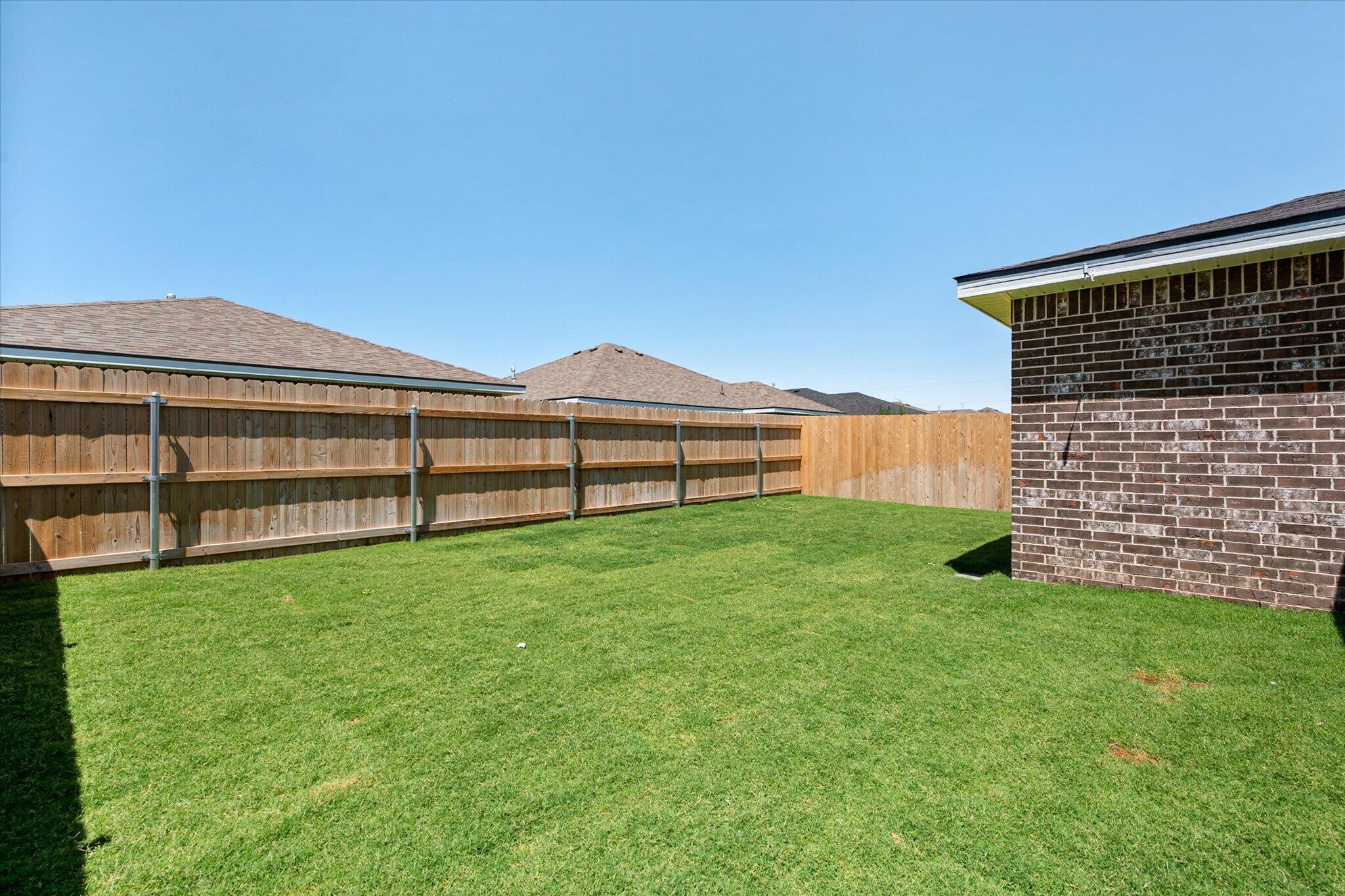 8312 25th Street Lubbock, TX 79407 - Photo 17 of 17 a view of a backyard with wooden fence