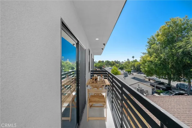a view of balcony and yard