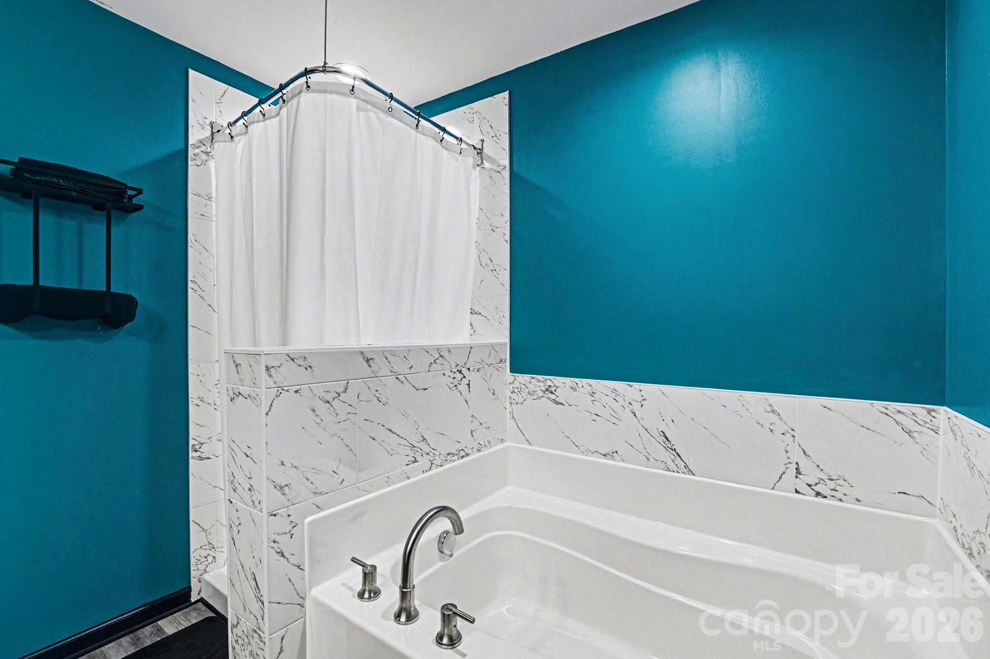 313 Bell Street Mount Holly, NC 28120 - Photo 13 of 19 a bathroom with a bathtub and shower