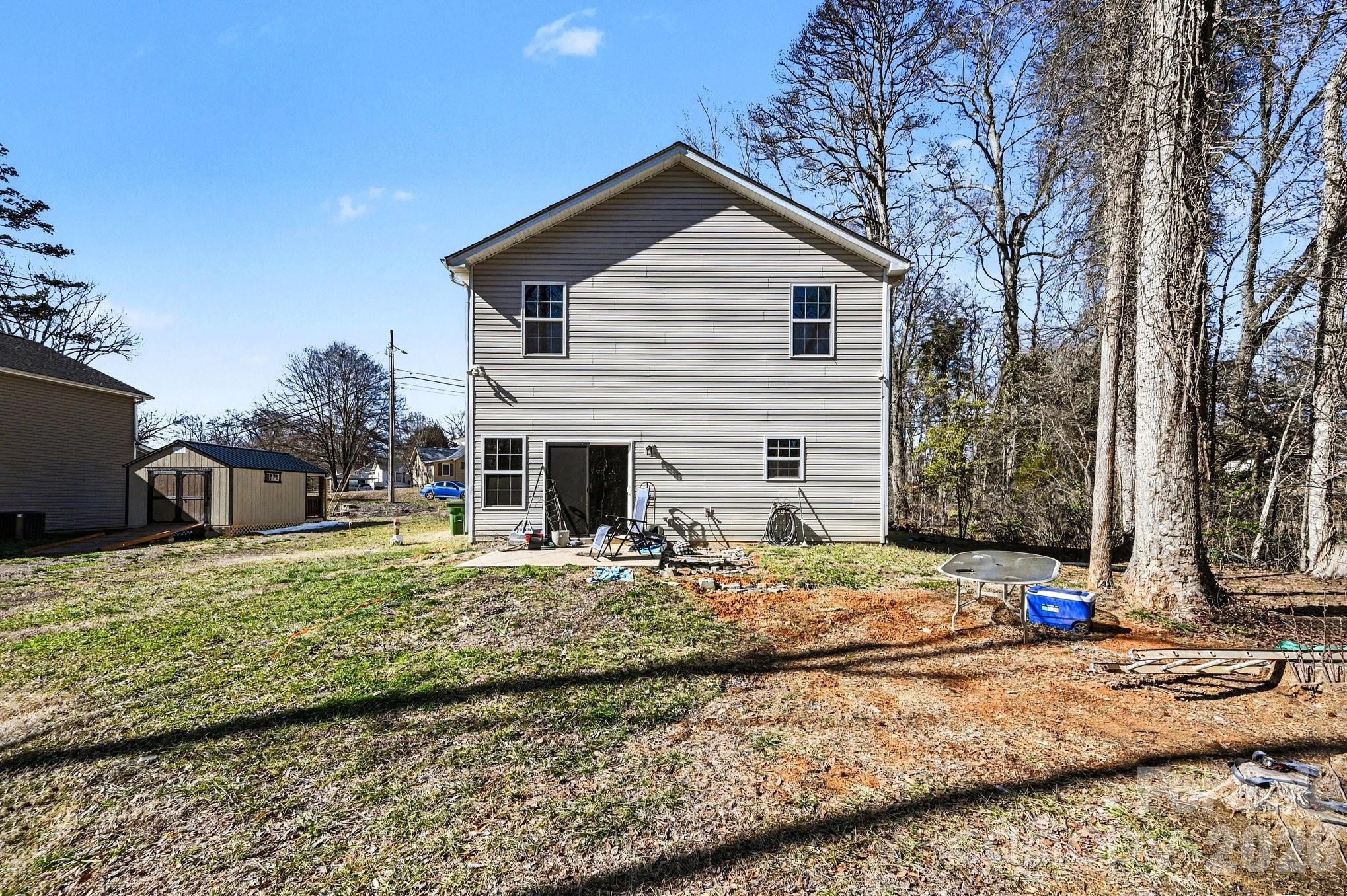 313 Bell Street Mount Holly, NC 28120 - Photo 16 of 19 a view of a house with snow on the side of road