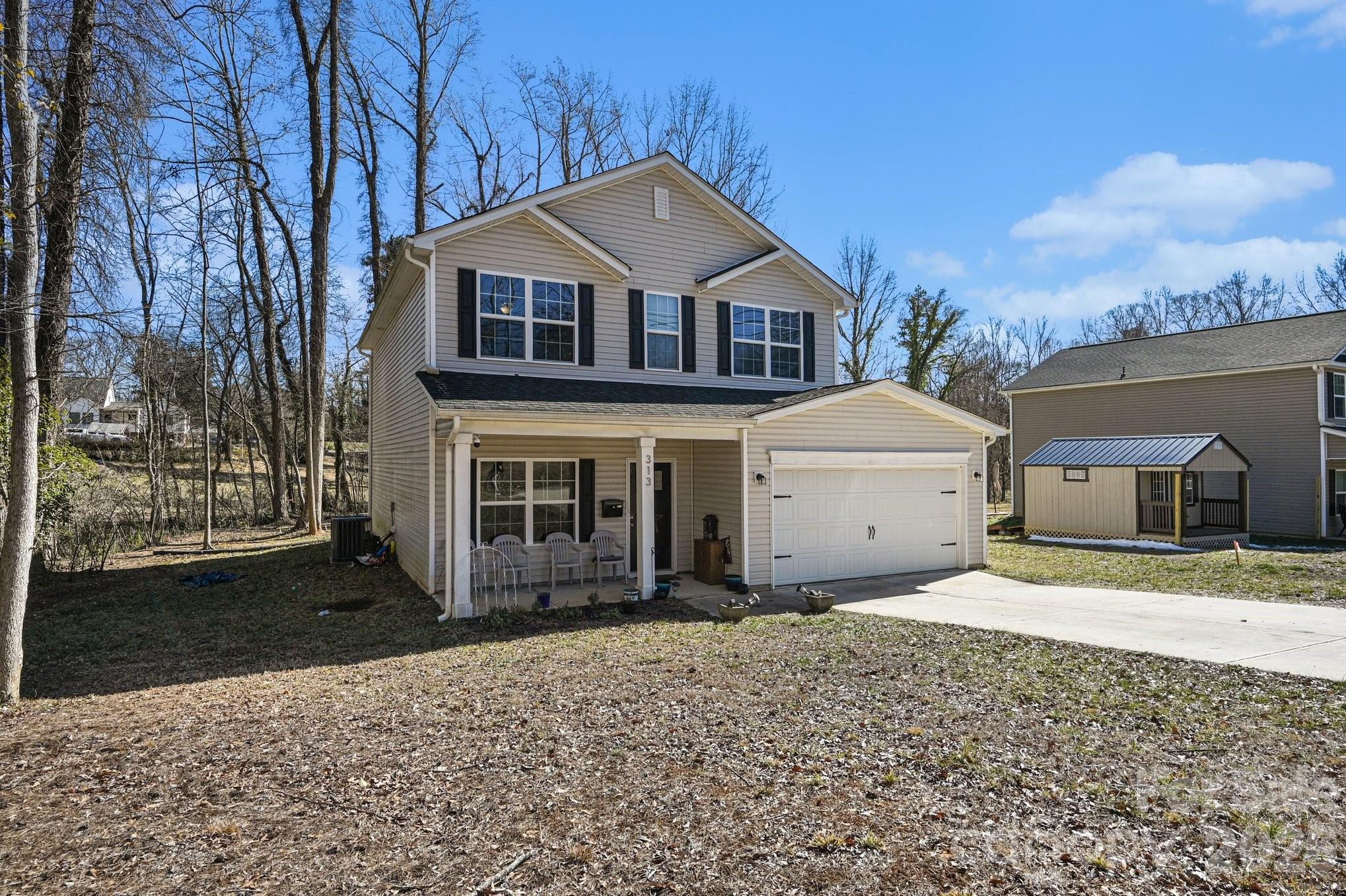 313 Bell Street Mount Holly, NC 28120 - Photo 19 of 19 a front view of a house with a yard