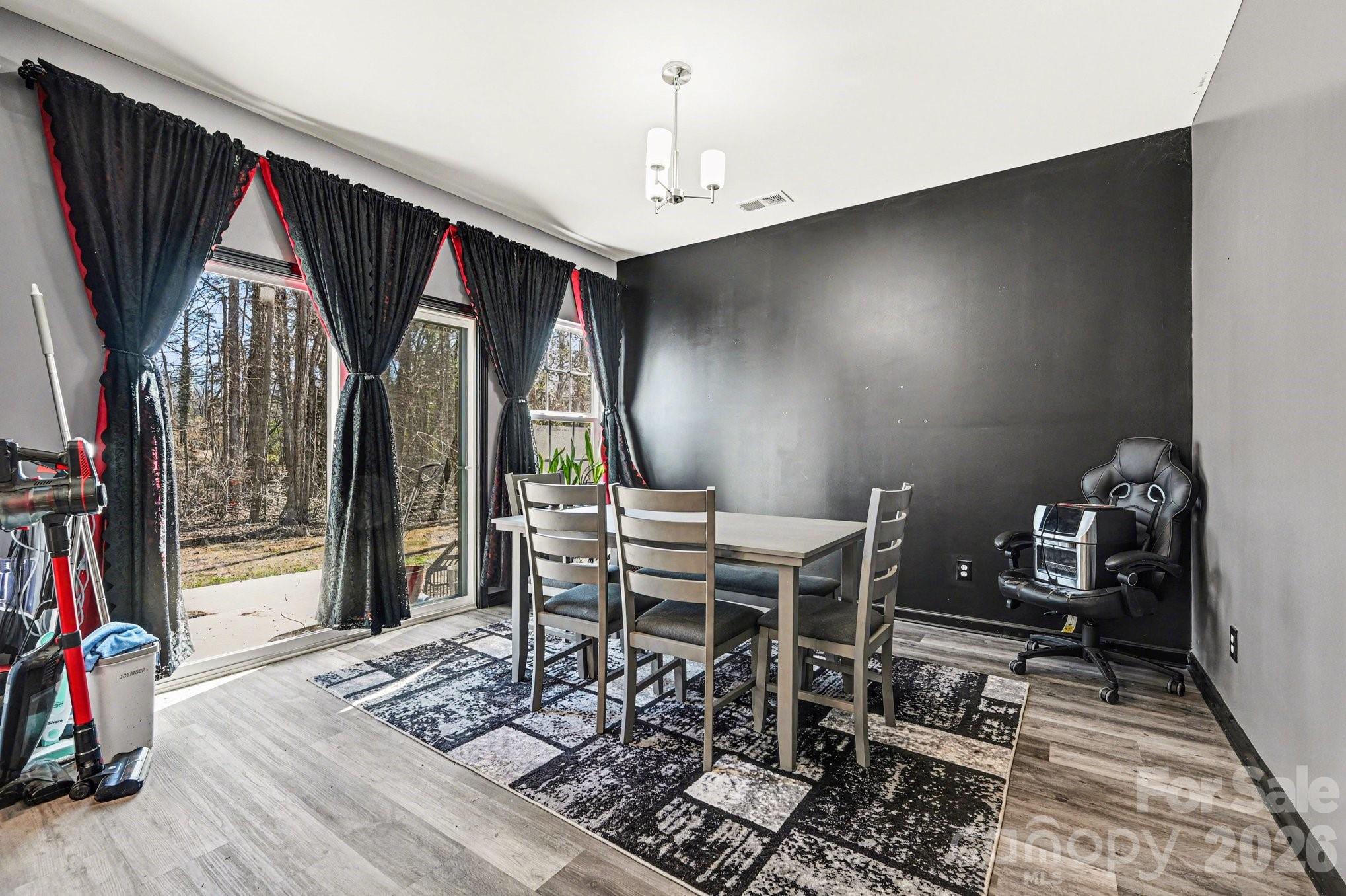 313 Bell Street Mount Holly, NC 28120 - Photo 5 of 19 a workspace with furniture window and outside view