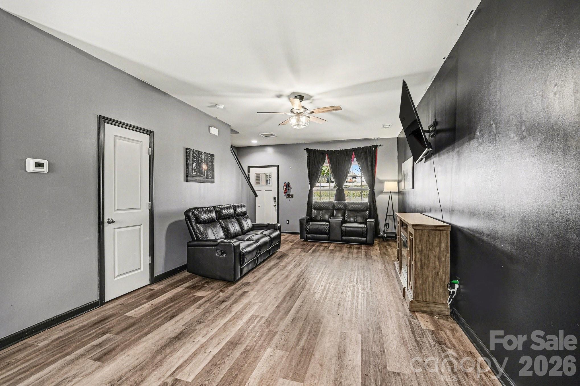 313 Bell Street Mount Holly, NC 28120 - Photo 6 of 19 a living room with furniture and a wooden floor