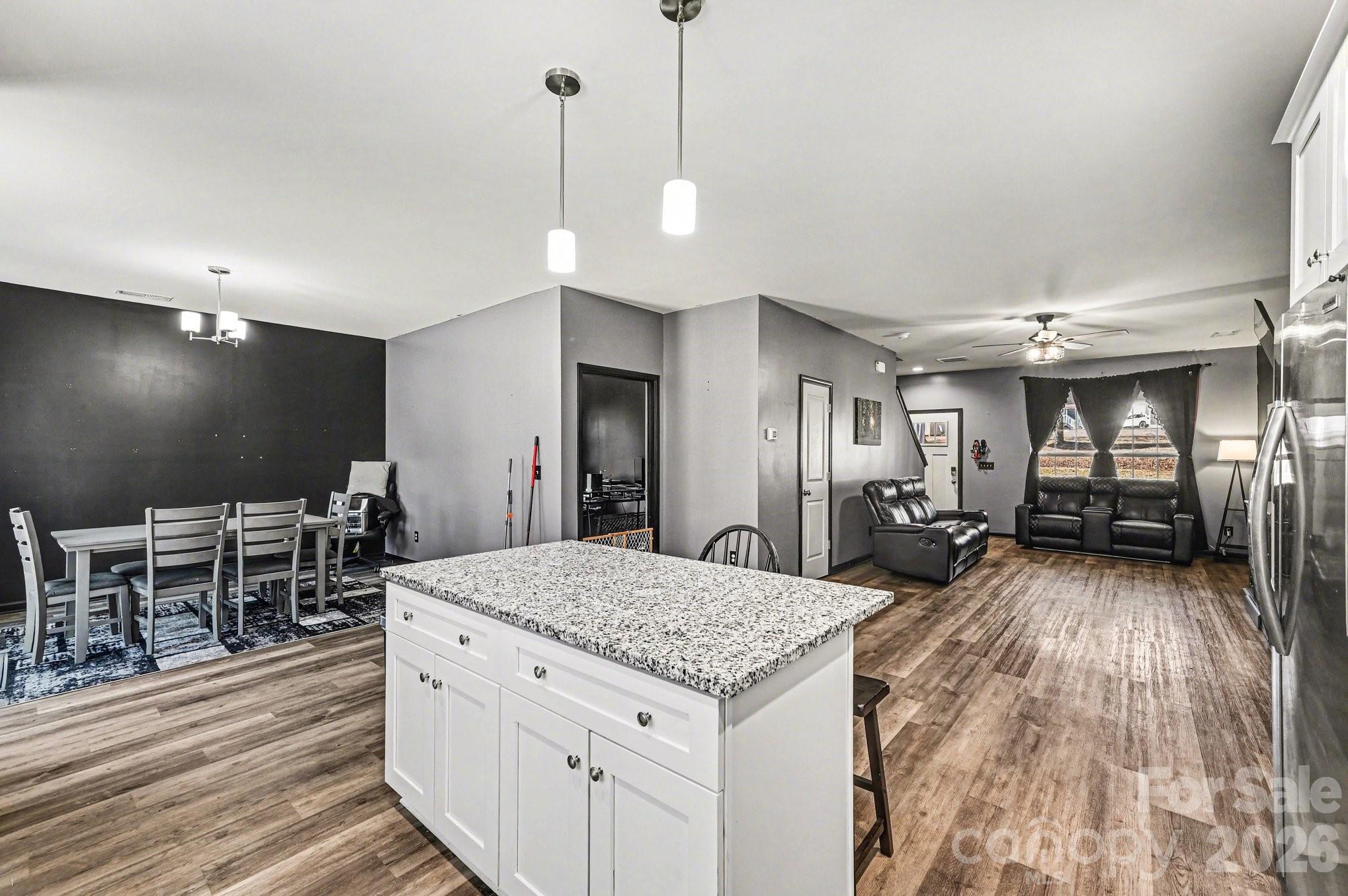 313 Bell Street Mount Holly, NC 28120 - Photo 9 of 19 a kitchen with sink and chairs