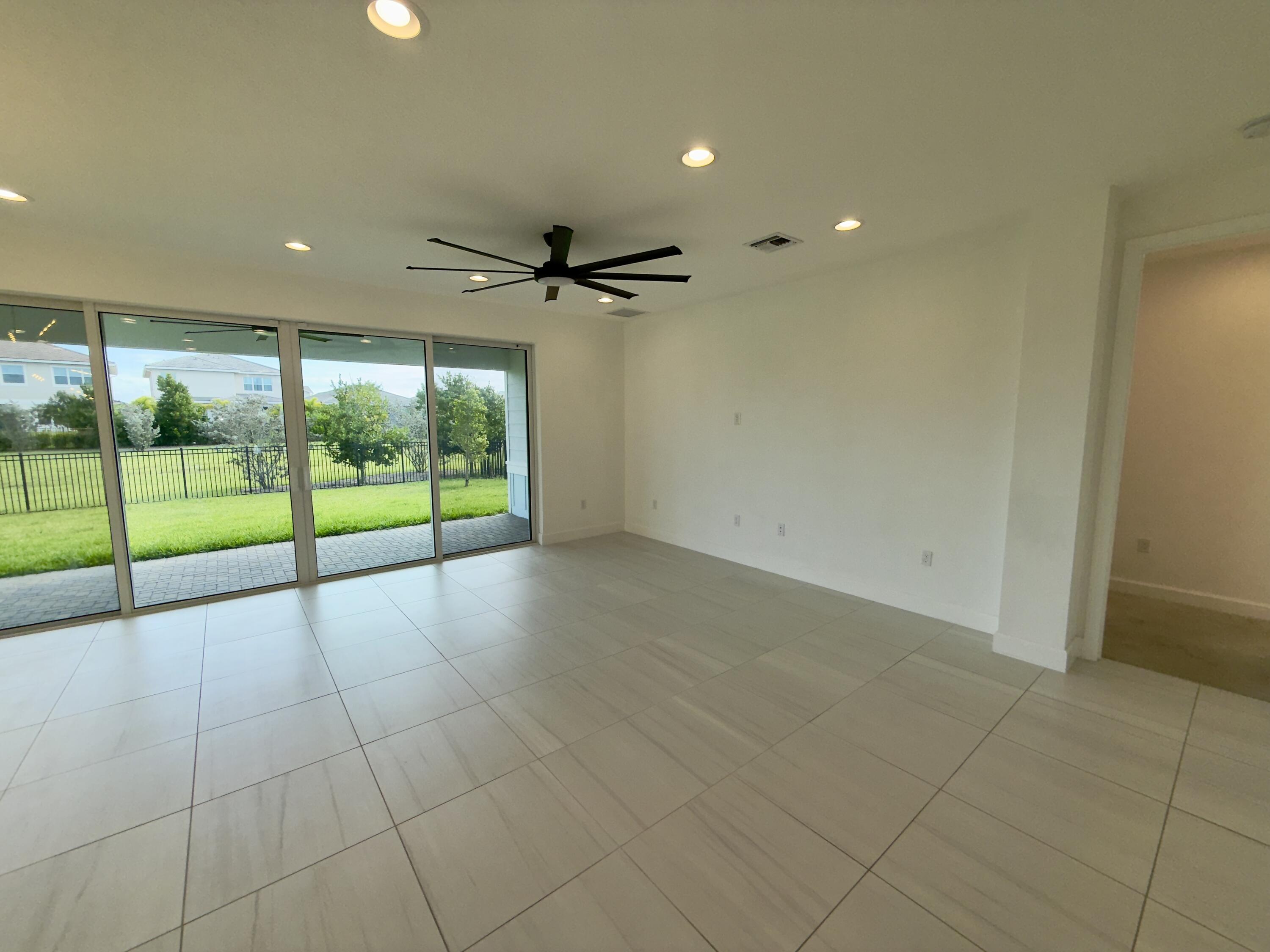 1346 Harvester Crossing Loxahatchee, FL 33470 - Photo 15 of 43 a view of an empty room with a window