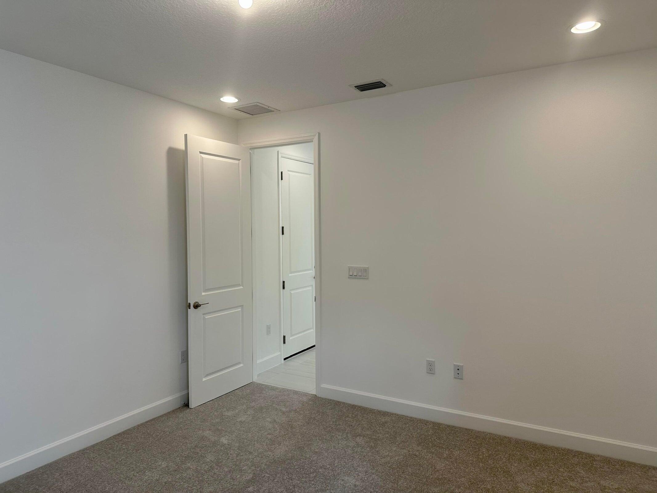 1346 Harvester Crossing Loxahatchee, FL 33470 - Photo 31 of 43 an empty room with closet area